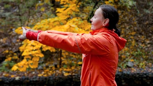 Woman Running in the Autumn Park