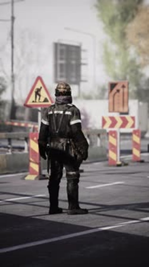 Road Worker Stands Guard Near Construction Site in Busy Urban Area
