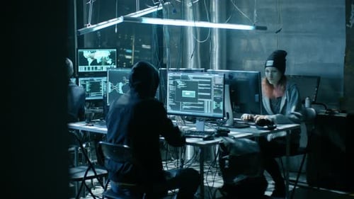 Coders Working on Computers in a Dark Room