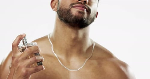 Beauty, cosmetics and man with cologne, fragrance and wellness against a grey studio background