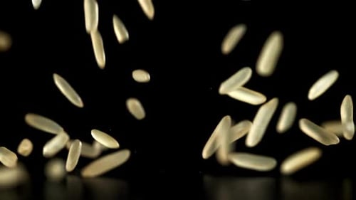 Rice Falling on a Black Background Filmed on a Highspeed Camera at 1000 Fps