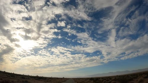 Wide angle view of the sky above the Mojave Desert landscape during a scenic drive