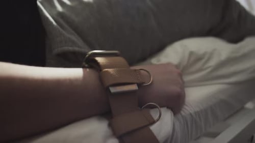 Hand Restrained on Hospital Bed