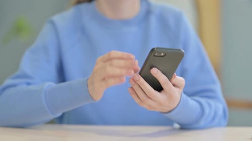 Woman Browsing Internet on Smartphone, Close up