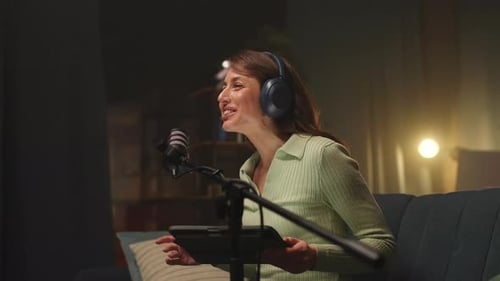 A Woman Podcasts in a Studio Engaging Guests with Storytelling and Advanced Recording Tech