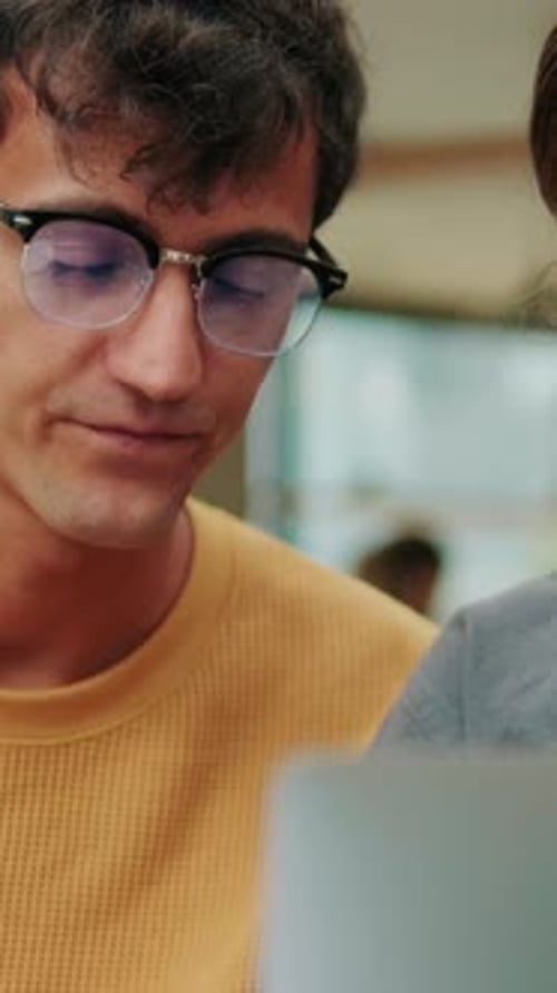 Close up of students of different nationalities use modern technology, laptop for studying