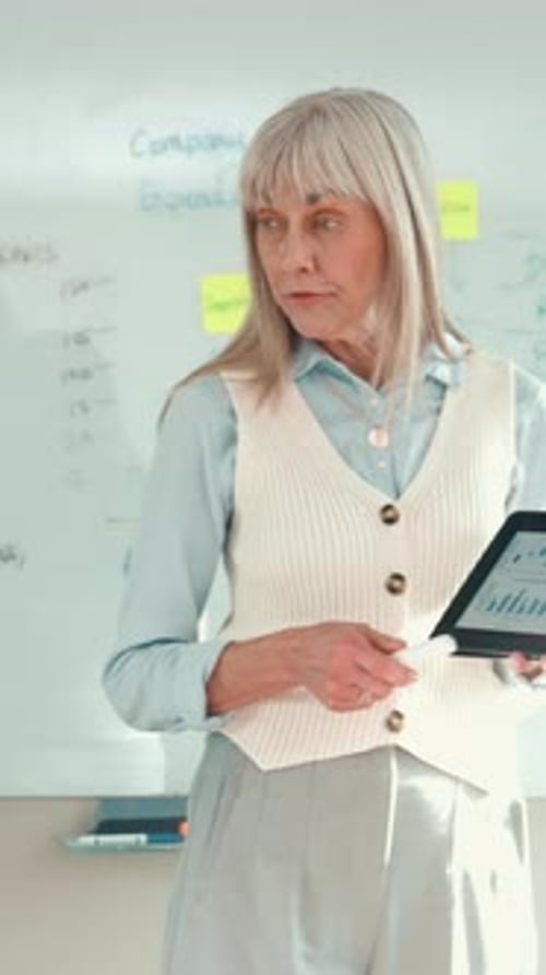 Woman, tablet and screen with graph in office for financial performance, budget and profit stats