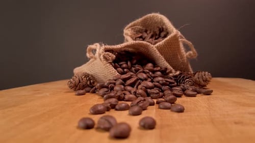 Coffee Beans in Burlap Sacks on Wooden Surface