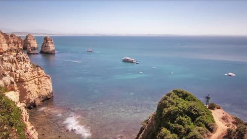 Rocky Sea Shore and Sailing Ships. Time Lapse of Cruise Ships Swimming