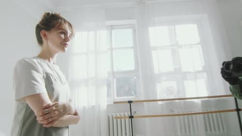 Model Being Photographed in a Bright Studio