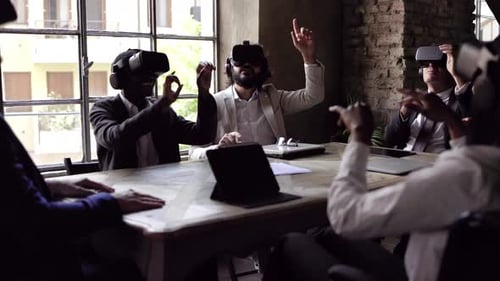 Multiracial business people wearing virtual reality futuristic goggles inside office