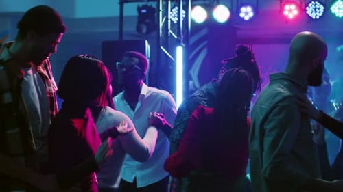 Dancing Crowd Enjoying Vibrant Nightlife at Club
