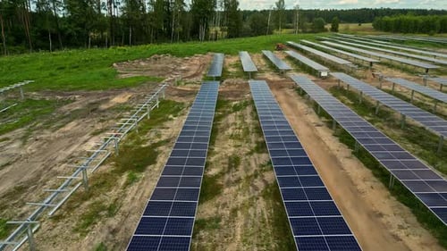 Partially completed rows of solar panels - drone flyover