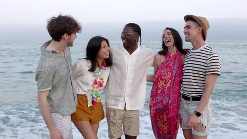 Smiling Friends Enjoying Vacation Together at the Beach