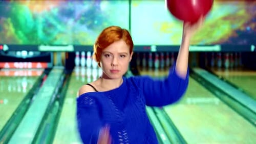 Girl Spins with Bowling Ball in Her Hands