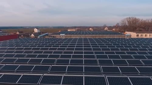 Top view of solar panel rooftop. Aerial view of solar panels installed on roof of factory