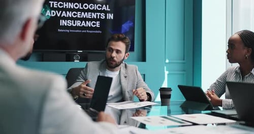 Business Team Discussing Technological Advancements in Insurance