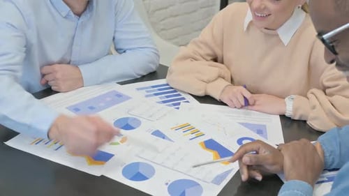 Close up of Business People Working on Documents