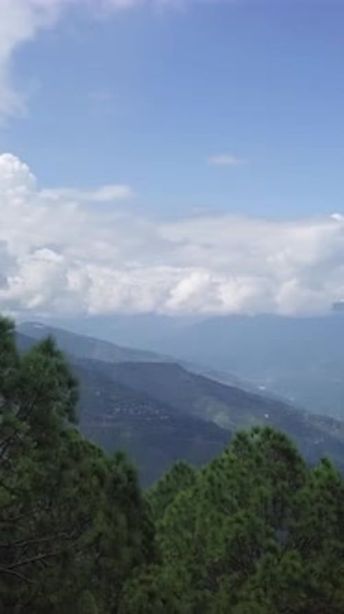 A Breathtaking Mountain Landscape Adorned with Lush Green Trees Captures the Beauty of Nature Stock