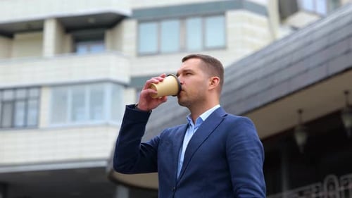 Camera Moving Around Young Handsome Male Standing Outdoors Drinking Coffee Close Up Portrait of