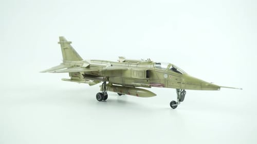 Scale Model of a Fighter Jet on White Surface