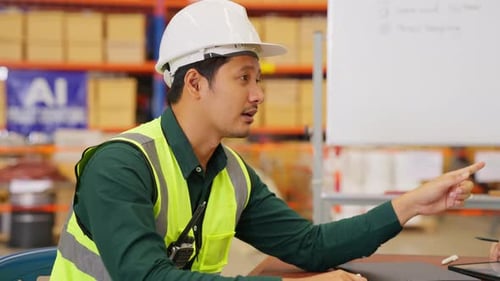 Happy Warehouse Engineers Team with Safety Vest Using Tablet