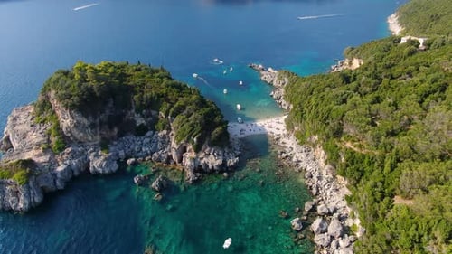 Aerial View of Limni Beach Glyko in Corfu Greece with Double Bay Turquoise Waters and Lush Green Hil