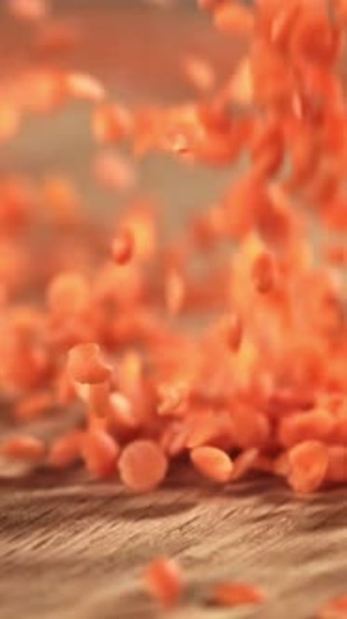 Red Lentils Fall on the Table Filmed on a Highspeed Camera at 1000 Fps