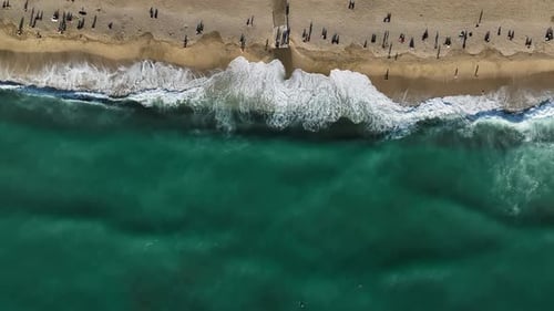 Aerial View of Beach with Waves and Turquoise Water