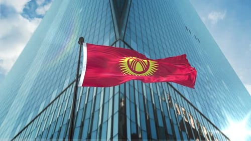 Waving Flag of Kyrgyzstan on Modern Corporate Building Background