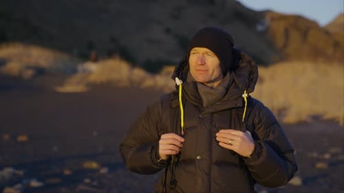 Man Enjoying The Scenery Of Iceland Black Sand Beach