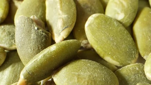 Vividly hued green pumpkin kernels.