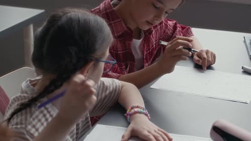 Students in Classroom Studying and Writing