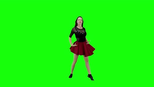 A young woman dancing on a green screen background