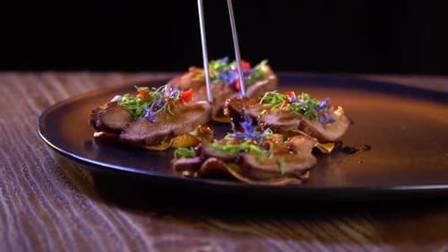 Final touches before serving a dish with a drink, in a restaurant
