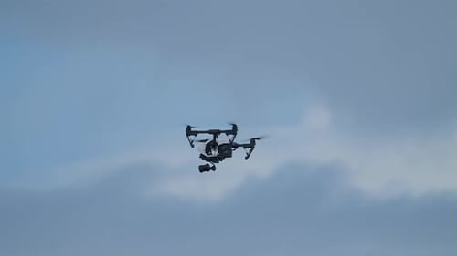 Drone Hovering in the Blue Sky