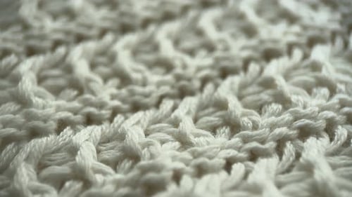 Macro Detail of a Knitted Off-White Textile