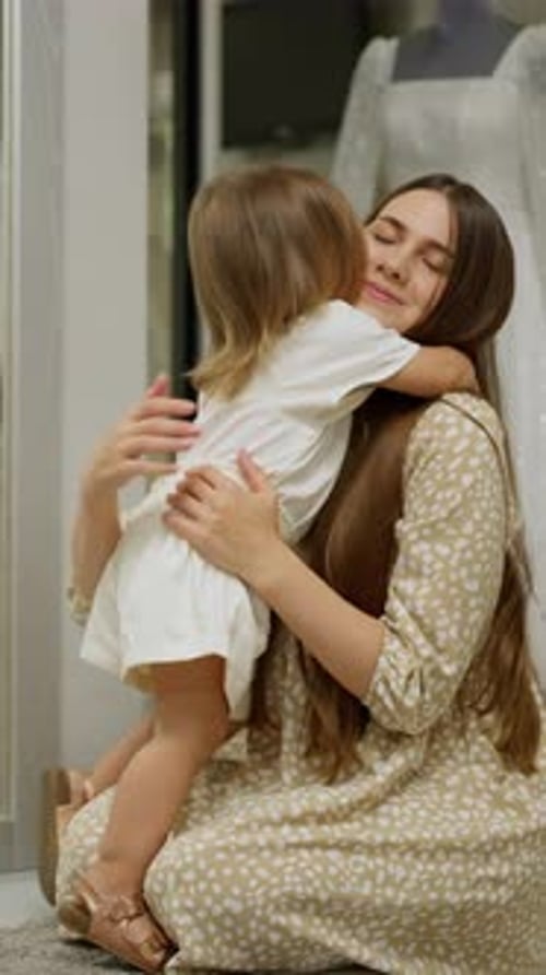 Mother and Daughter Share a Sweet Embrace