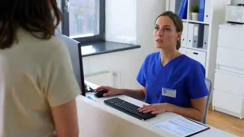 Hispanic doctor showing something to patient at hospital healthcare concept