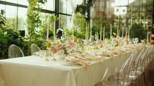 Elegant Wedding Reception Table Setting with Floral Centerpieces