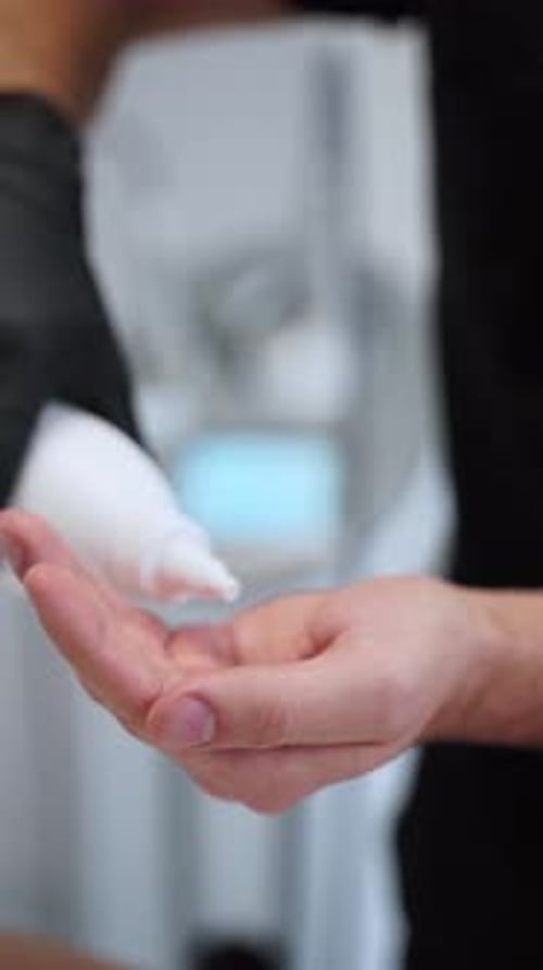 Hand Applying Massage Lotion for Spa Treatment Skincare Routine with Nourishing Cream in Cosmetology