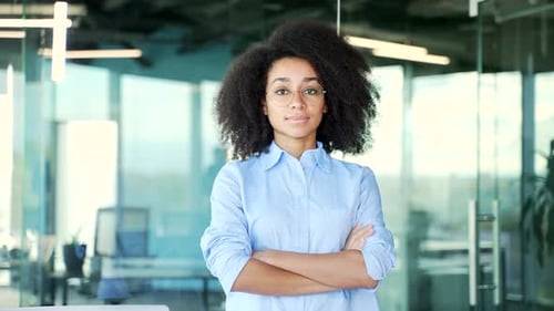 Confident Woman Standing in Modern Office