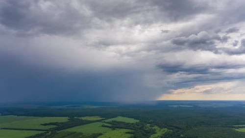 Stormy sky timelapse. Aerial timelapse of the sky with heavy rain cloud moving over the rural area