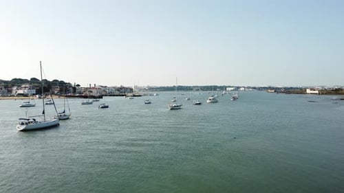 Sailboats Floating In The Calm Waters Of Bay At Daytime. - aerial