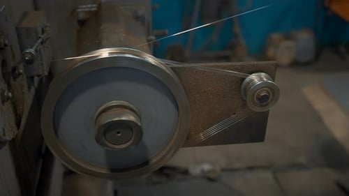 Industrial Rotating Machine with wire. Creative. Rotating coils winding wire at factory. Industrial