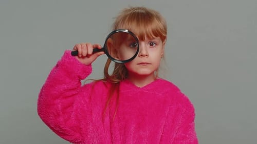 Curious Preteen Child Girl Kid Holding Magnifying Glass Near Face Funny Eye Searching Analysing