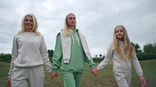 Three Generations of the Family are Walking in the Park