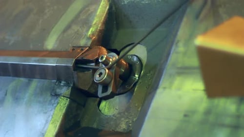 Automated steel wire bending machine roller unit forms metal workpiece at factory