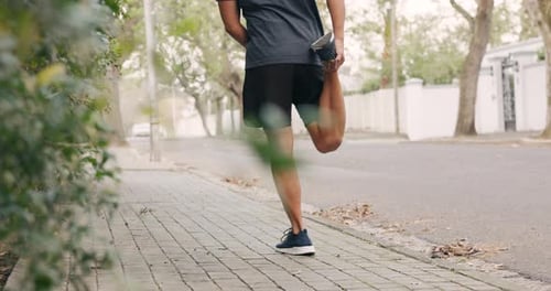 Man Stretches his Legs Outdoors