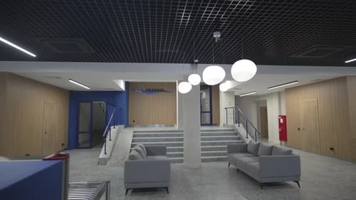 Cozy Hall with Soft Sofas and Friendly Reception Desk